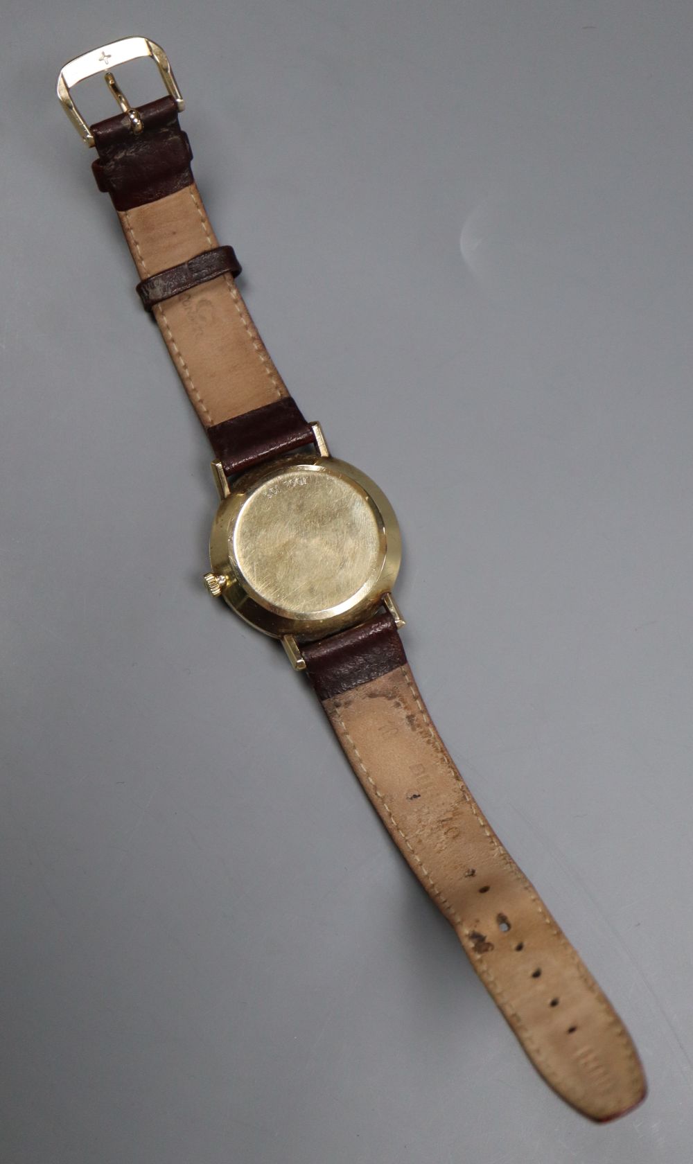 A gentlemans 1970s 9ct gold Omega automatic wrist watch, movement c.1012, movement no. 38167699, on associated strap,